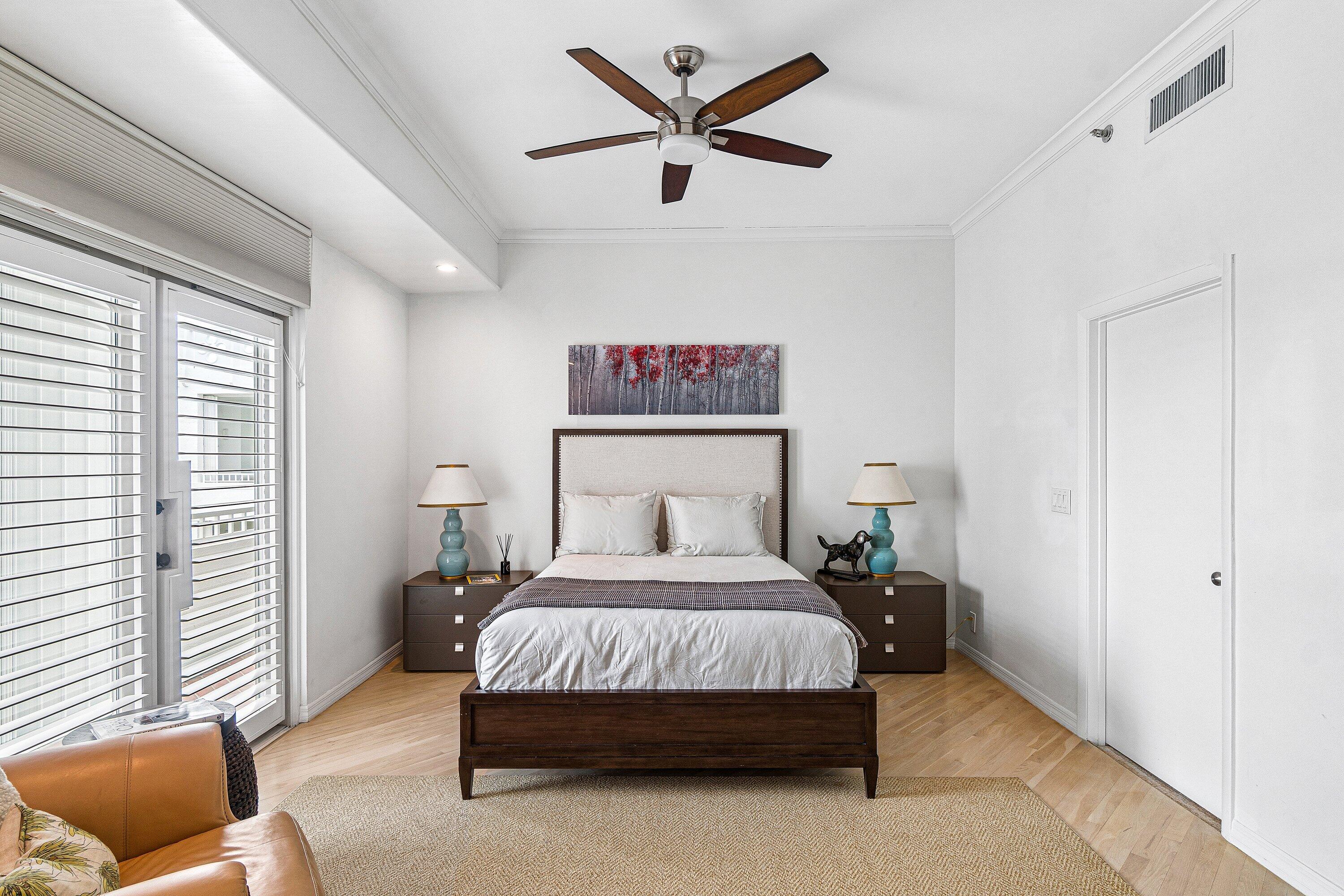 300 Southeast 5th Avenue, Unit PH 8120 Boca Raton, FL 33432 - Photo 21 of 54 a bedroom with a bed and a couch