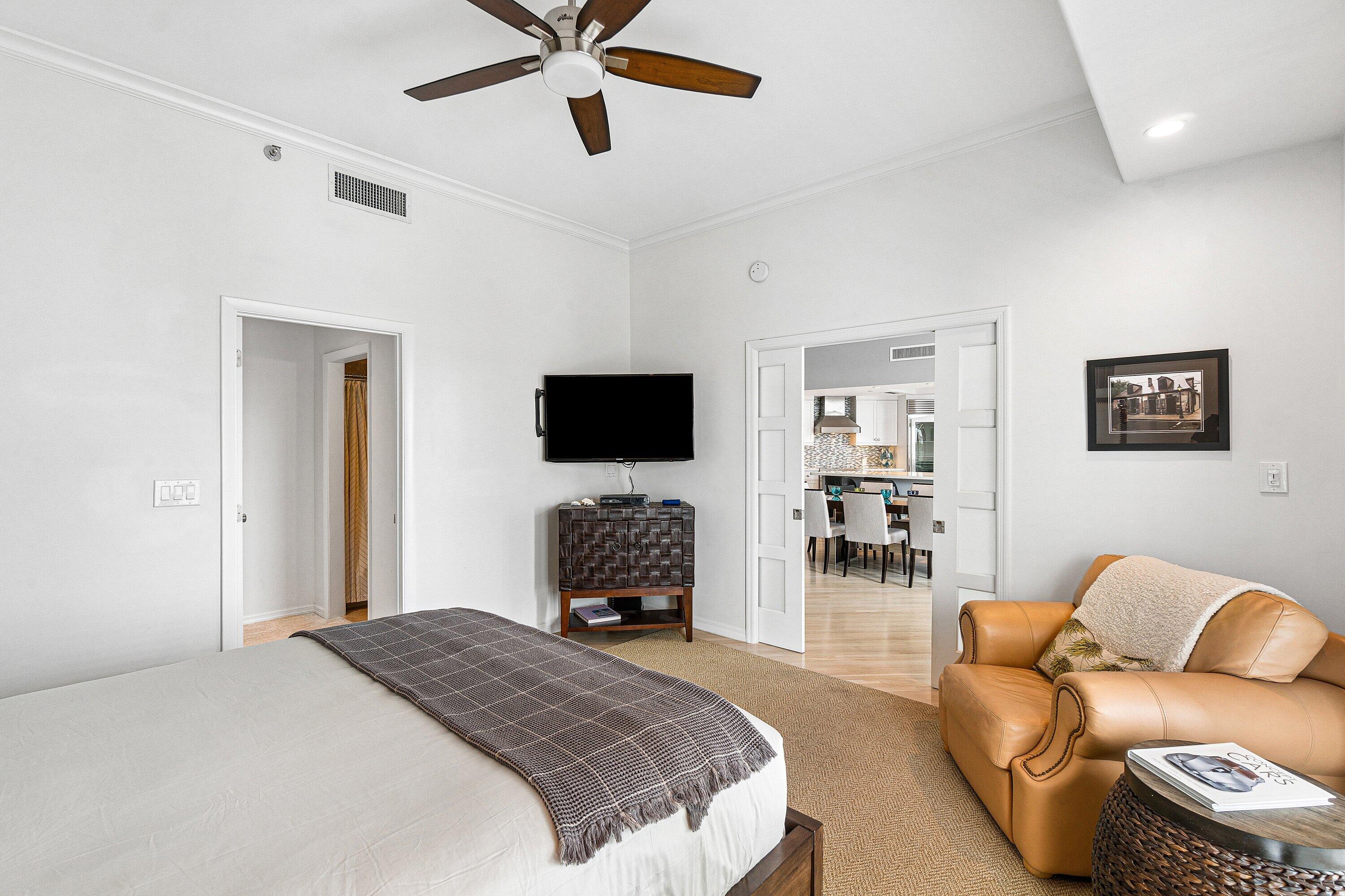 300 Southeast 5th Avenue, Unit PH 8120 Boca Raton, FL 33432 - Photo 22 of 54 a bedroom with a bed and a flat screen tv