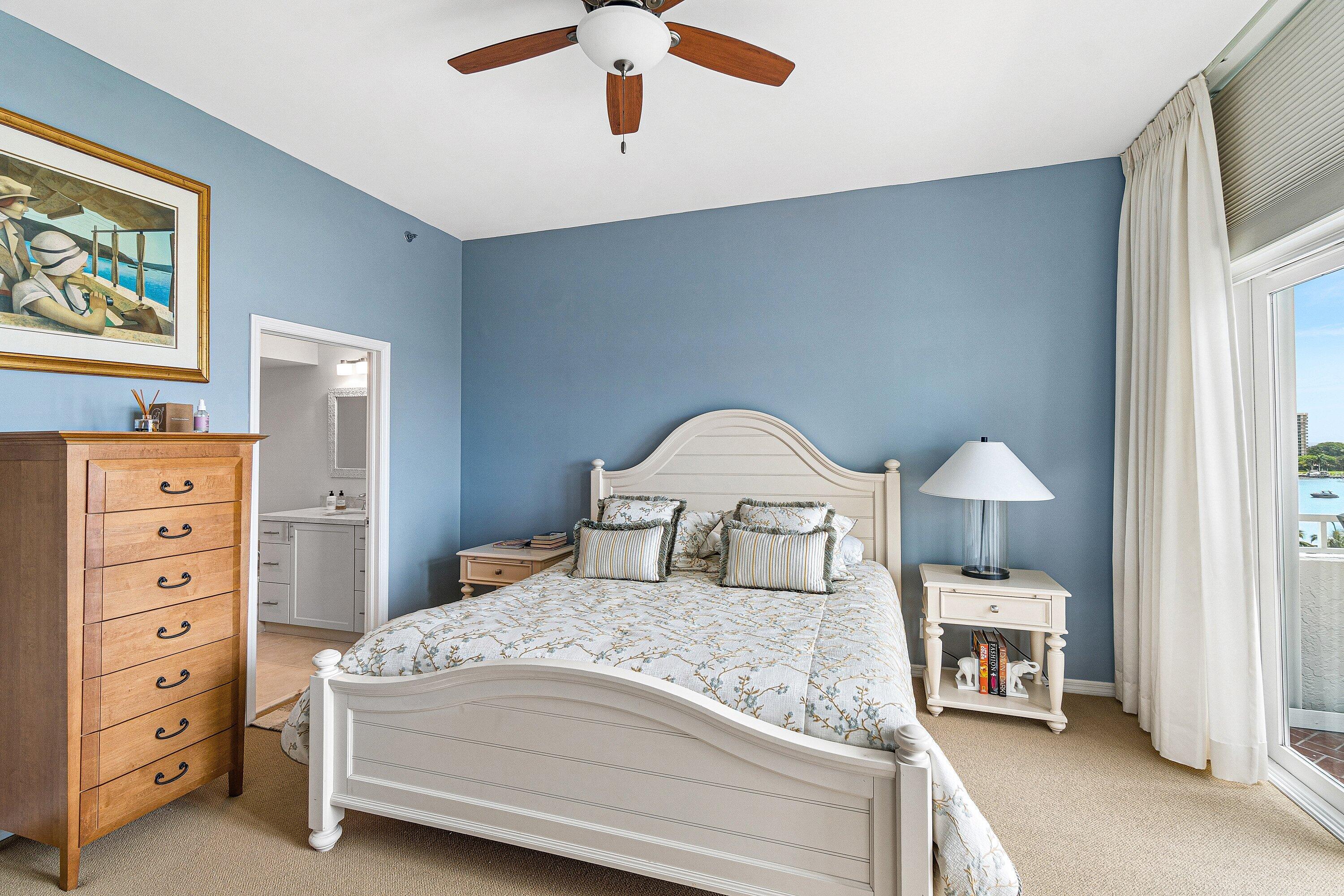 300 Southeast 5th Avenue, Unit PH 8120 Boca Raton, FL 33432 - Photo 24 of 54 a bedroom with a bed and a large mirror on the dresser