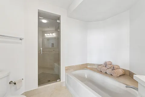 a view of a room with chairs and a table
