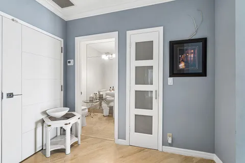 a bathroom with a toilet a sink and a mirror