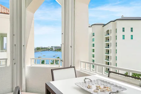 a view of a balcony and dining area