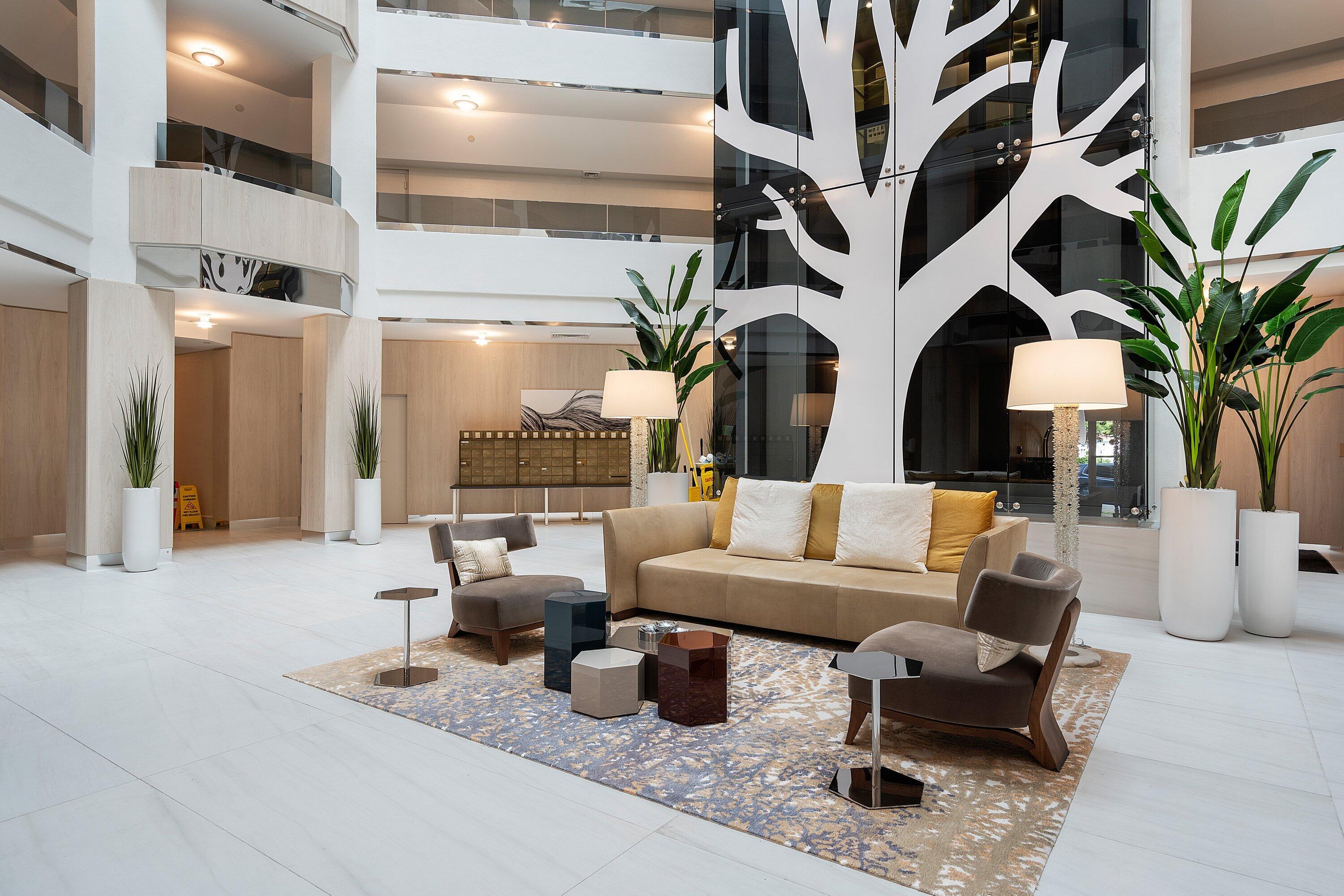 300 Southeast 5th Avenue, Unit PH 8120 Boca Raton, FL 33432 - Photo 36 of 54 a living room with furniture and a potted plant