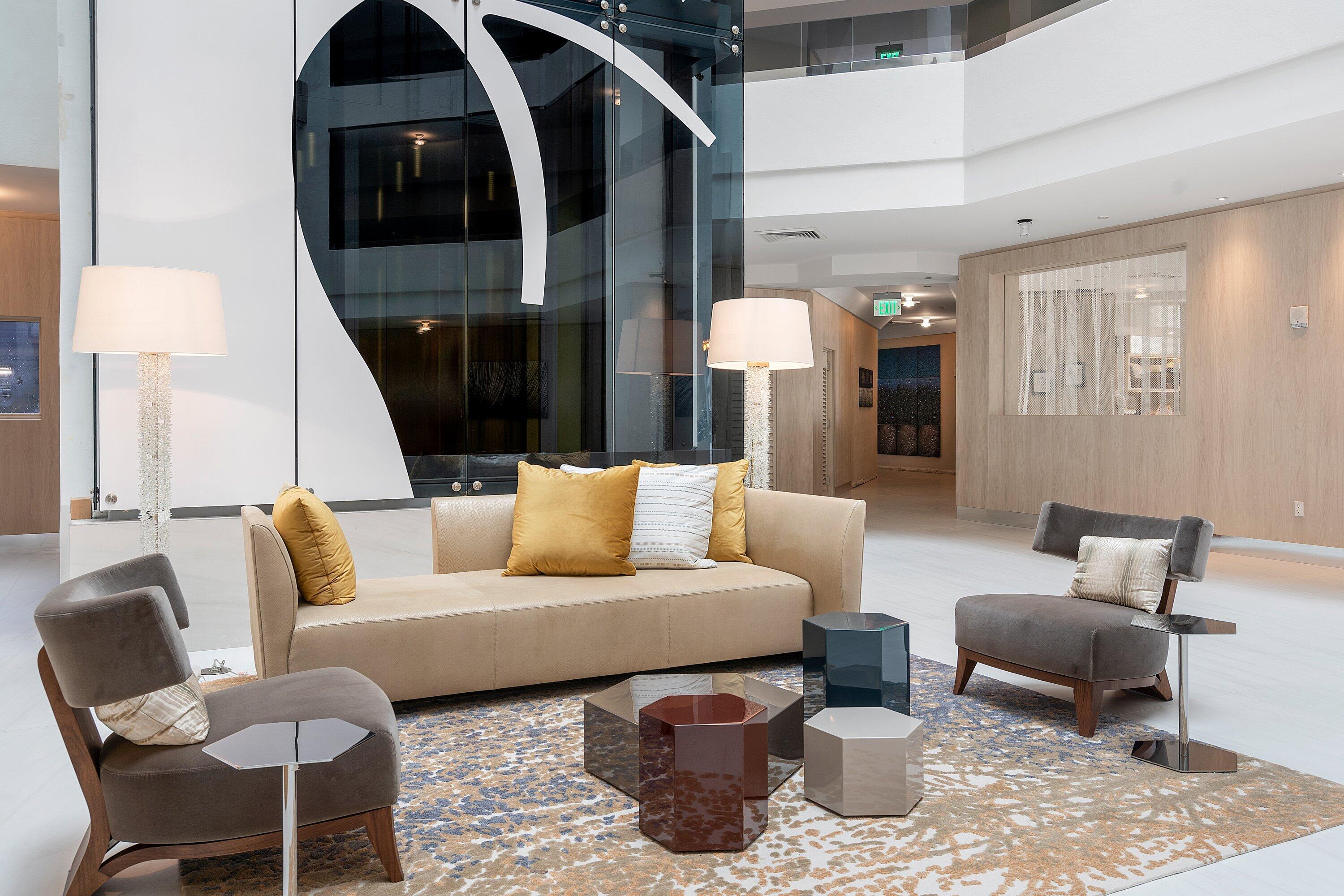 300 Southeast 5th Avenue, Unit PH 8120 Boca Raton, FL 33432 - Photo 38 of 54 a living room with furniture and a fireplace