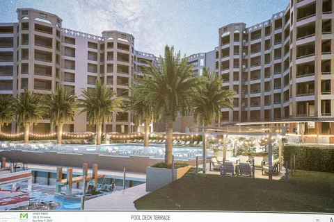 a view of a swimming pool with outdoor seating