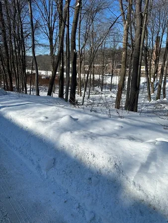 a view of snow on the side of the road