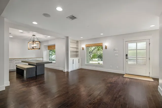 a view of kitchen and dining room with wooden floor