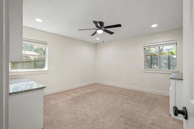a view of a kitchen with a sink hardwood floor and a window