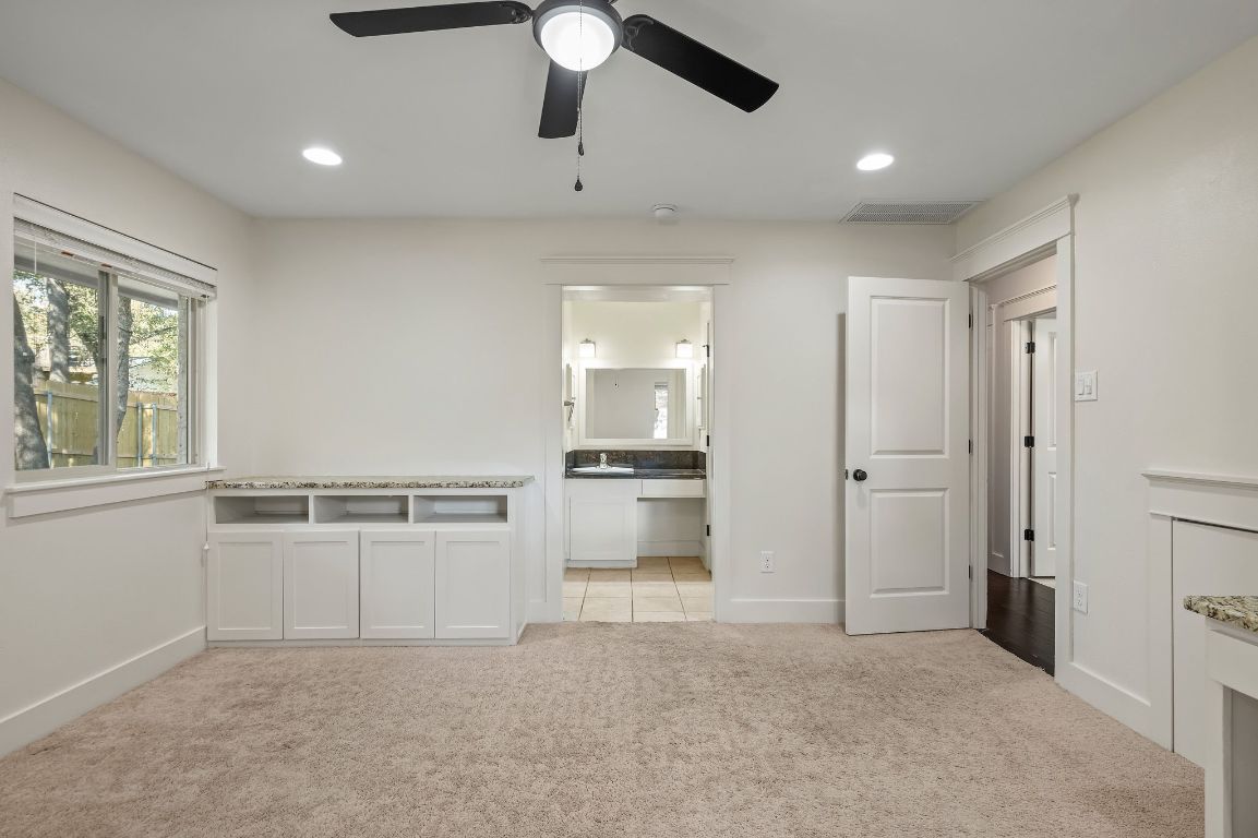 7202 Running Rope Circle Austin, TX 78731 - Photo 24 of 40 a view of a kitchen with a sink hardwood floor and a window