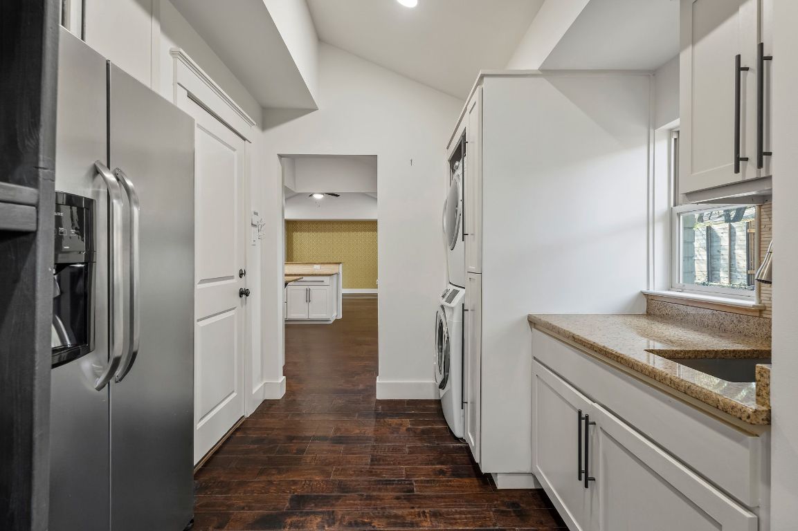 7202 Running Rope Circle Austin, TX 78731 - Photo 27 of 40 a kitchen with stainless steel appliances granite countertop a refrigerator and a sink