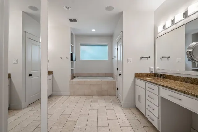 a bathroom with a shower and a sink