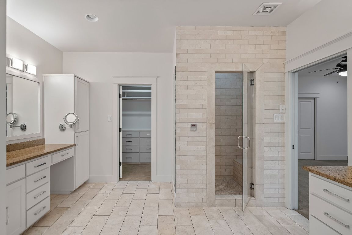 7202 Running Rope Circle Austin, TX 78731 - Photo 34 of 40 a bathroom with a shower and a sink