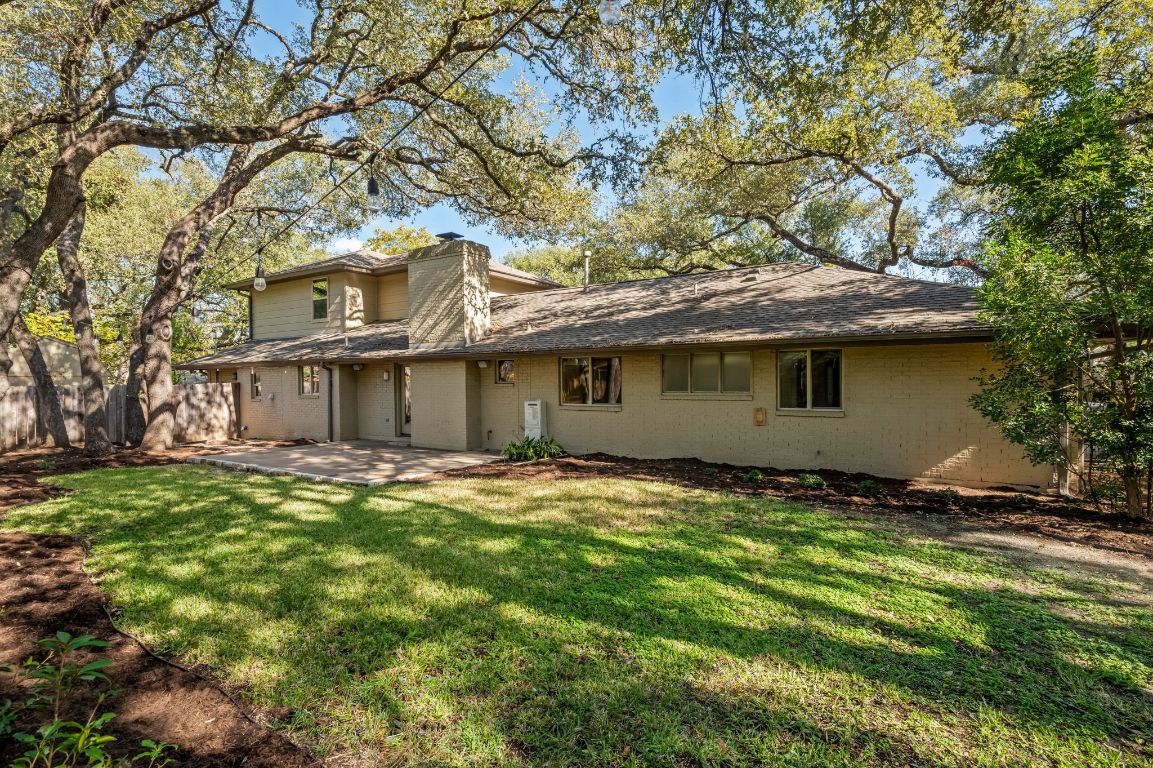 7202 Running Rope Circle Austin, TX 78731 - Photo 36 of 40 a view of a house with a yard