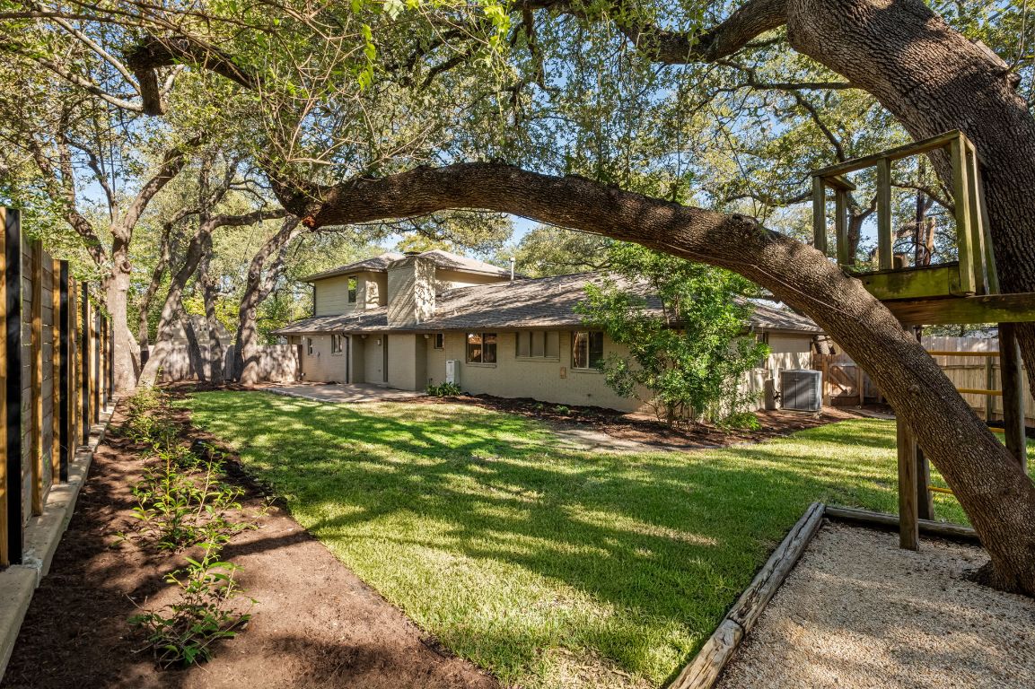 7202 Running Rope Circle Austin, TX 78731 - Photo 37 of 40 a view of a house with a yard