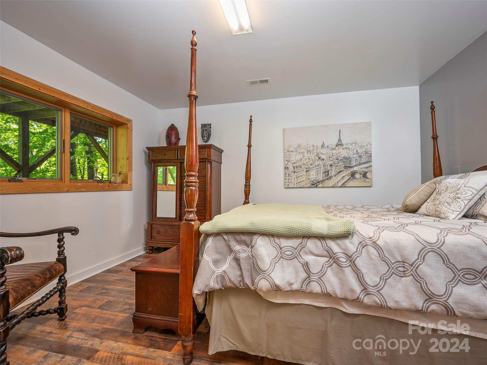 58 Next To The Last Road Saluda, NC 28773 - Photo 25 of 48 a bed sitting in a bedroom next to a window