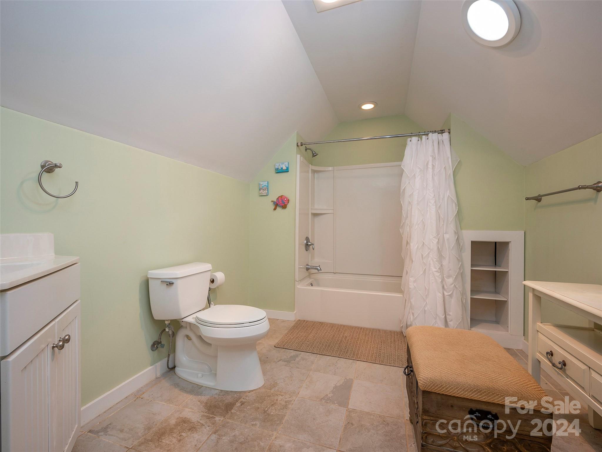 58 Next To The Last Road Saluda, NC 28773 - Photo 29 of 48 a bathroom with a toilet sink and shower