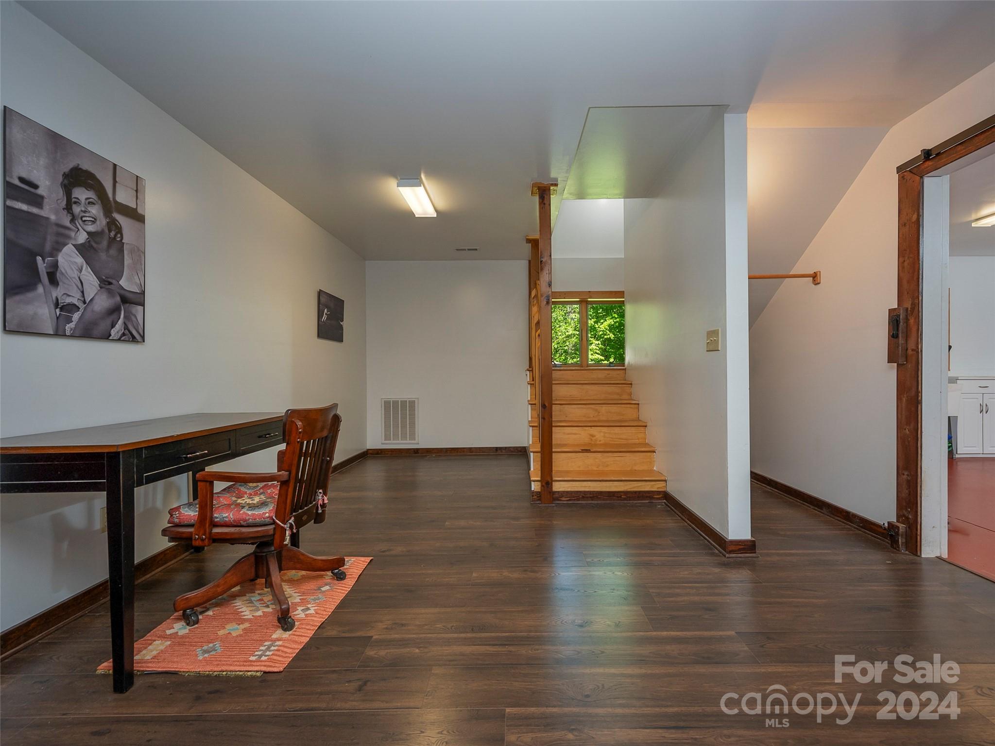 58 Next To The Last Road Saluda, NC 28773 - Photo 30 of 48 a view of a livingroom with furniture and a hallway