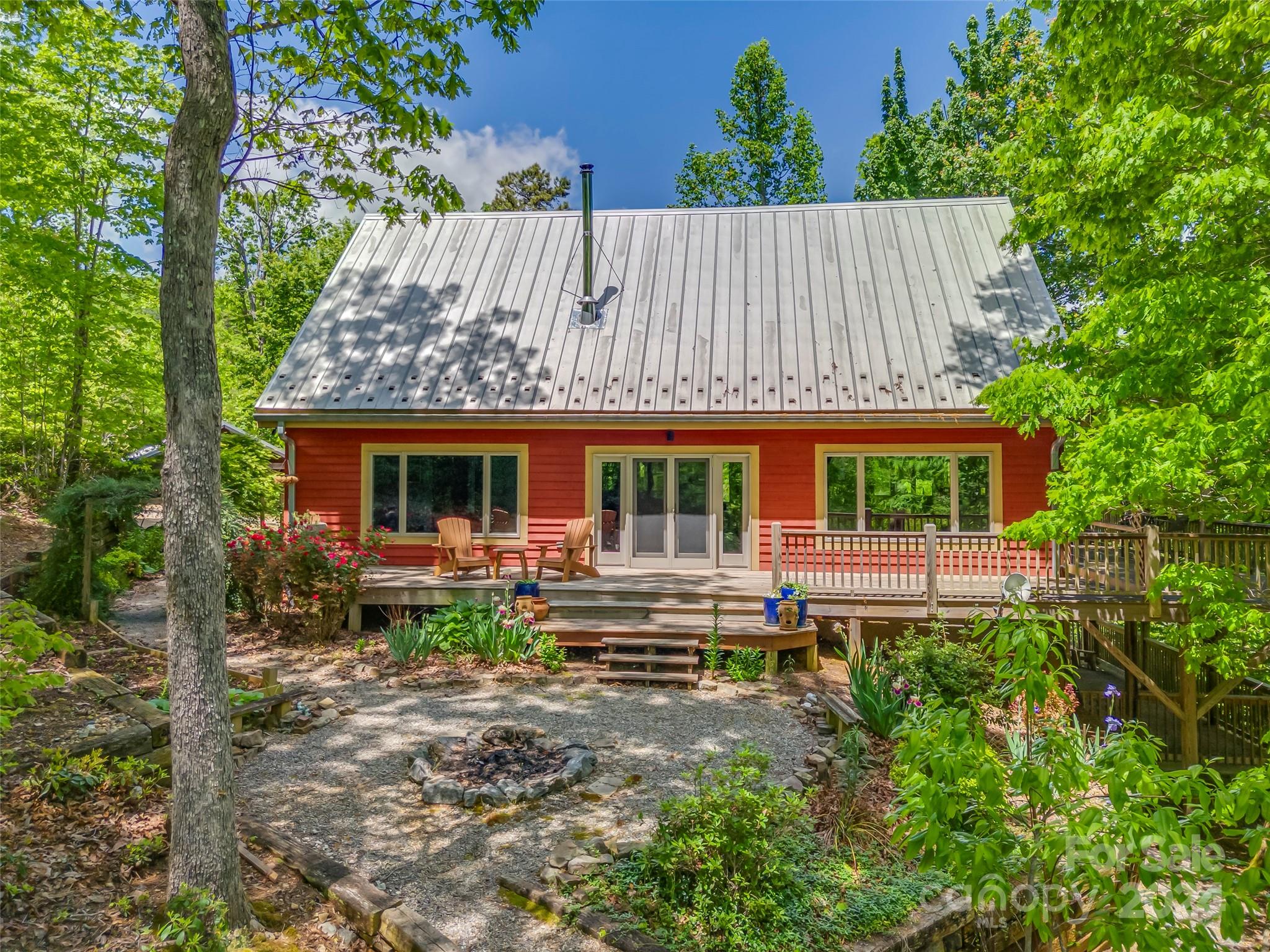 58 Next To The Last Road Saluda, NC 28773 - Photo 3 of 48 front view of a house with a yard