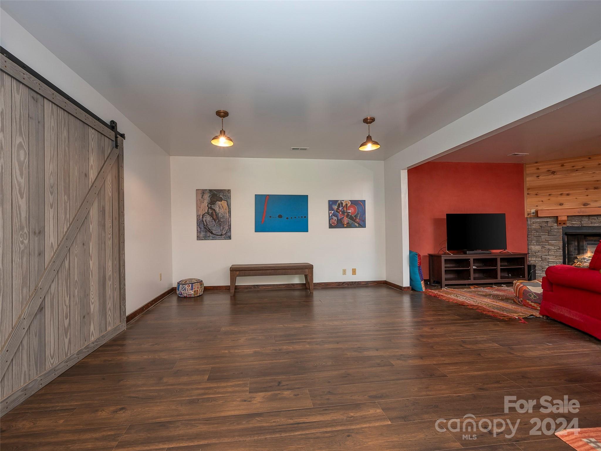 58 Next To The Last Road Saluda, NC 28773 - Photo 31 of 48 a view of a livingroom with furniture and a flat screen tv