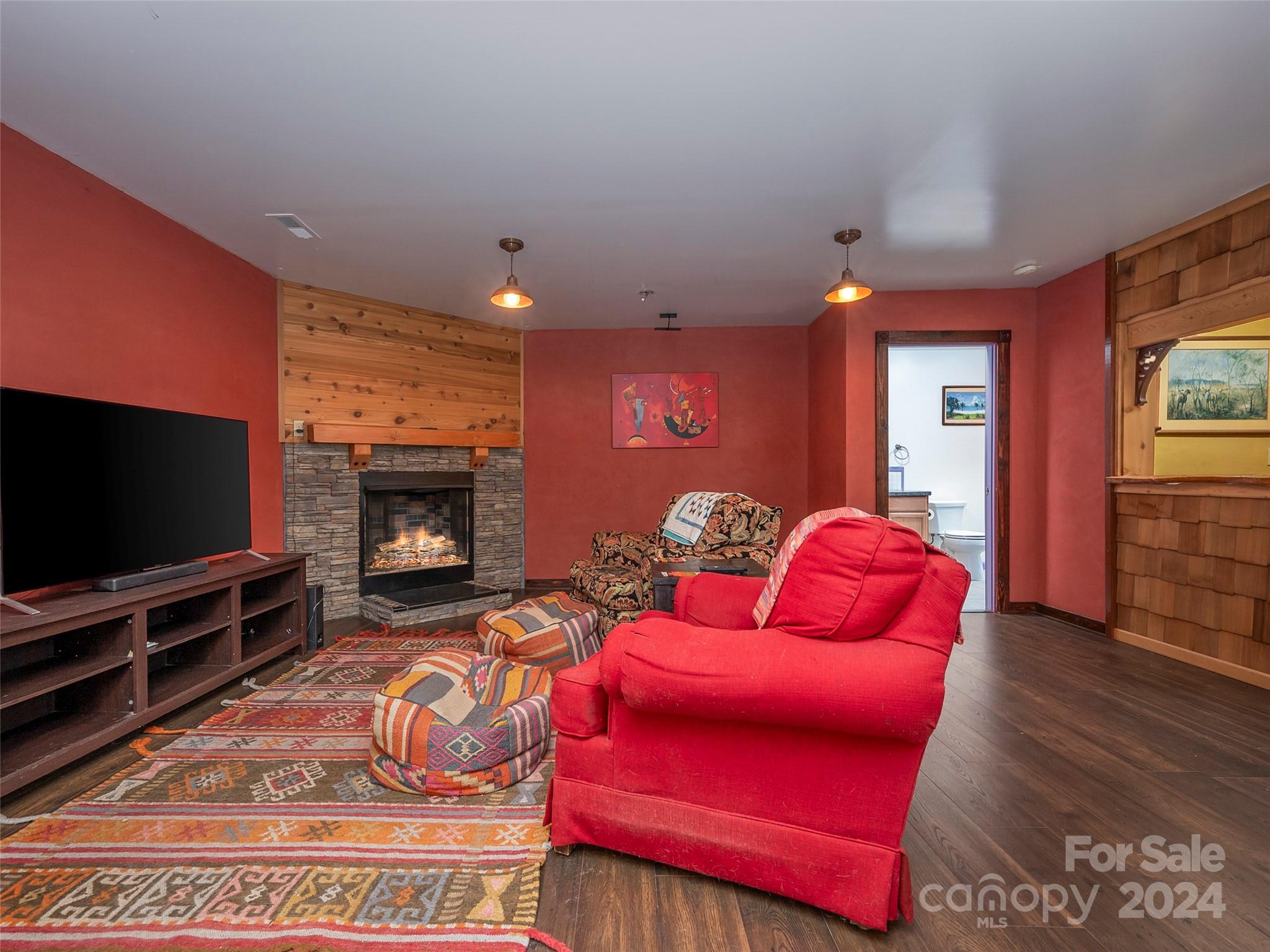 58 Next To The Last Road Saluda, NC 28773 - Photo 32 of 48 a living room with furniture and a flat screen tv