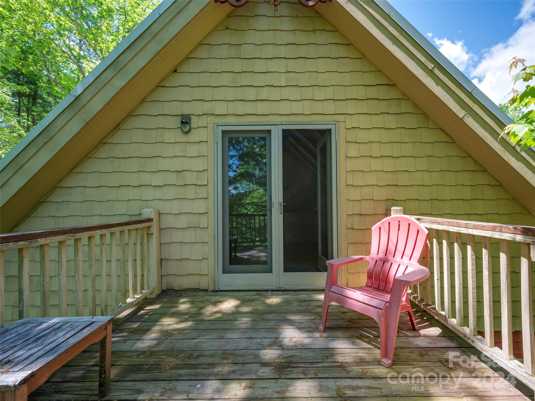 58 Next To The Last Road Saluda, NC 28773 - Photo 39 of 48 a backyard of a house with seating space