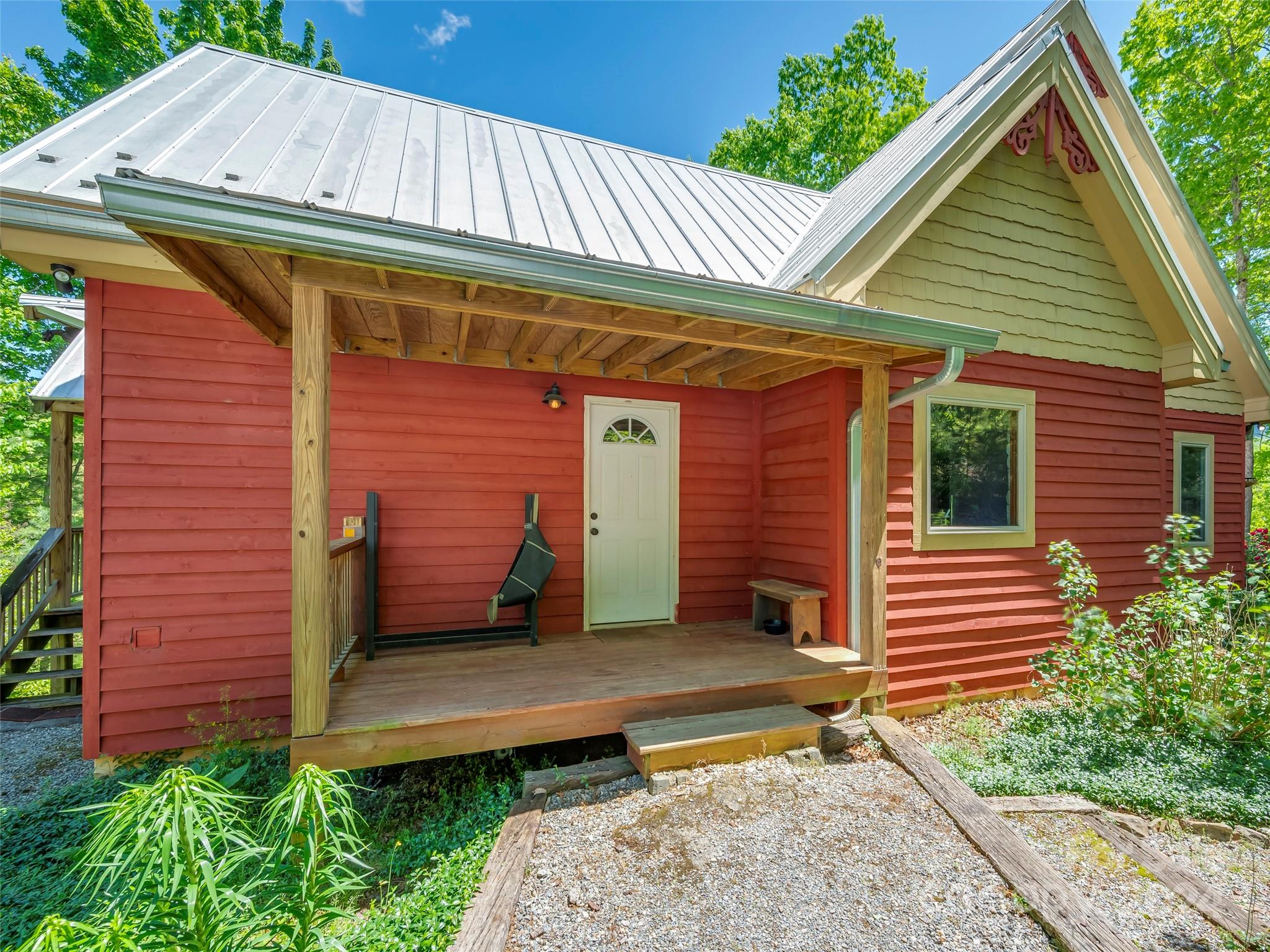 58 Next To The Last Road Saluda, NC 28773 - Photo 43 of 48 a front view of a house with a garden