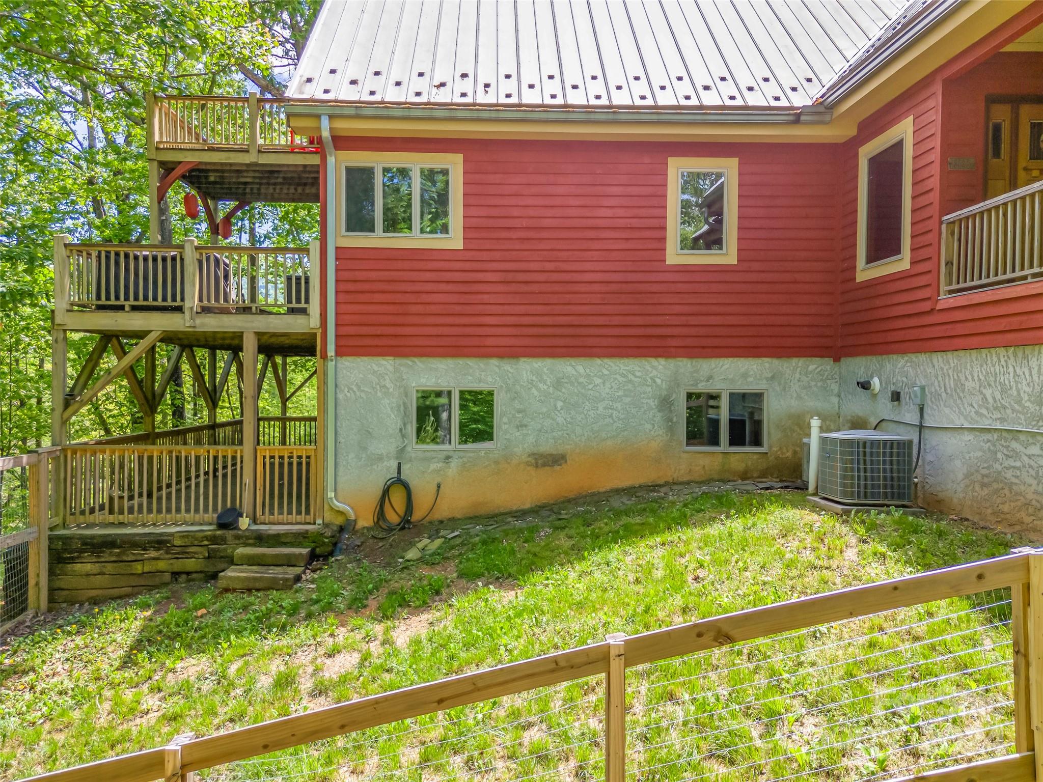 58 Next To The Last Road Saluda, NC 28773 - Photo 44 of 48 a view of backyard with a garden and deck
