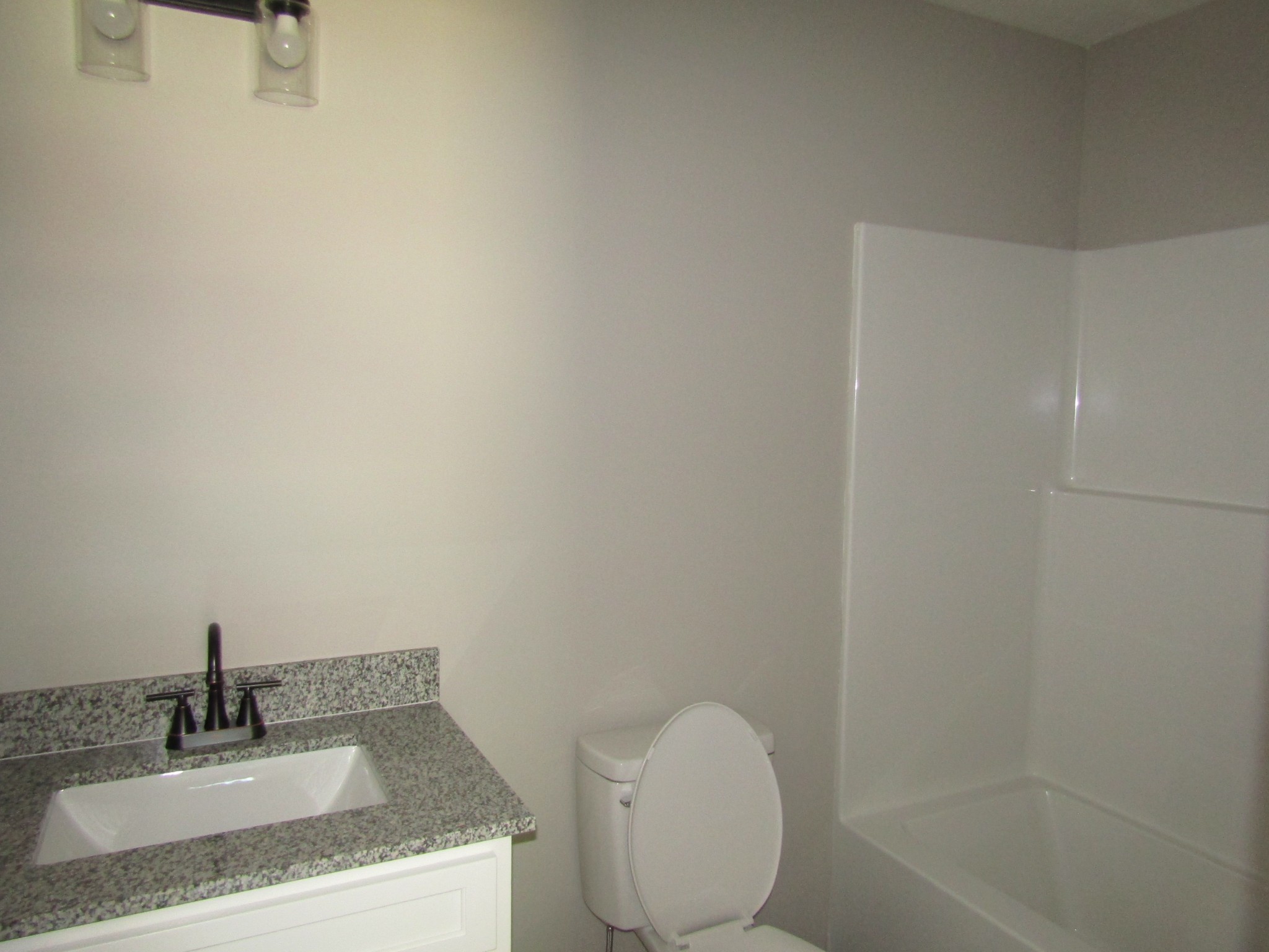 480 Crescent Factory Road Lawrenceburg, TN 38464 - Photo 10 of 14 a bathroom with a granite countertop sink toilet and shower