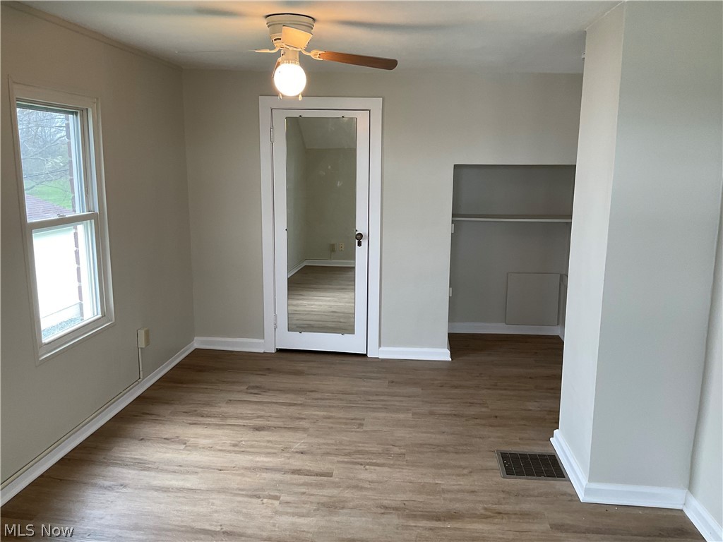 3475 South Turner Road Canfield, OH 44406 - Photo 18 of 33 Spare room with dark hardwood / wood-style flooring and ceiling fan