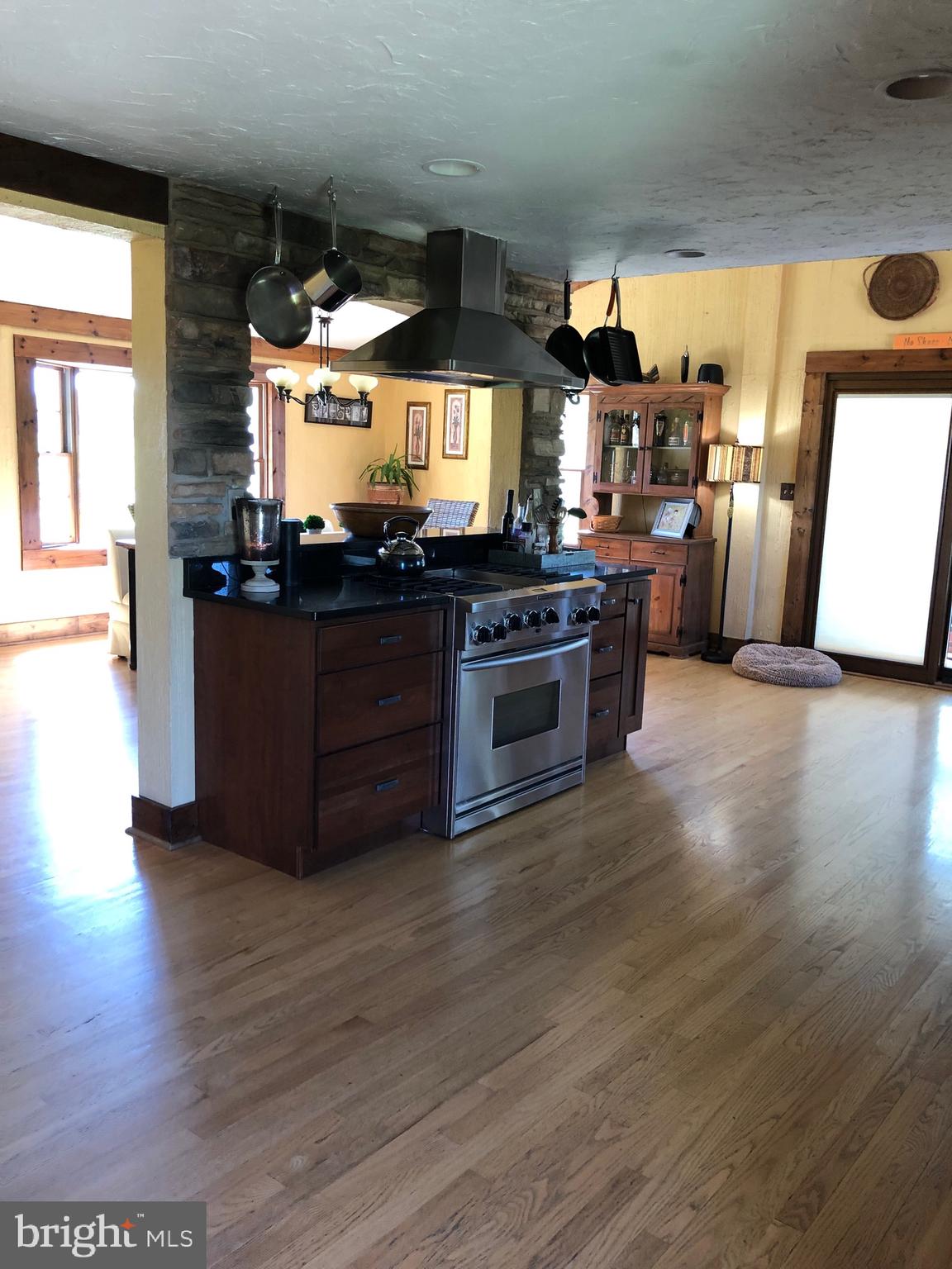 Open kitchen full of all the needed appliances