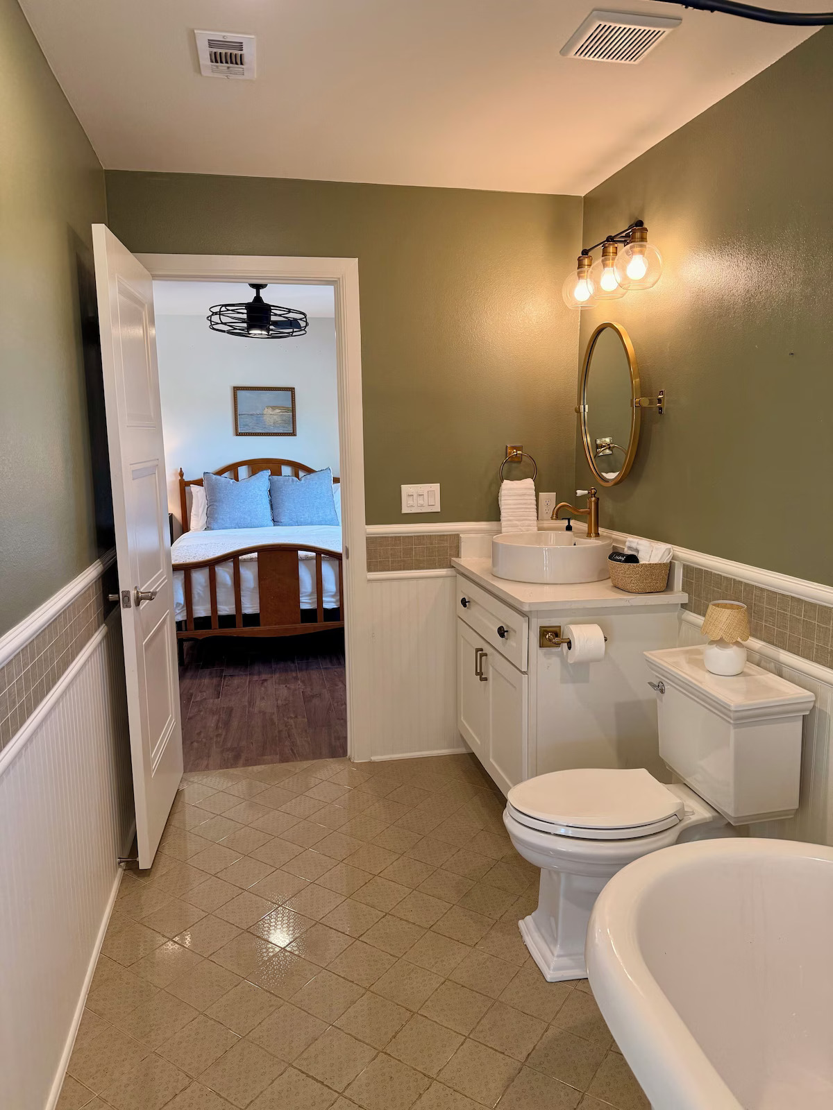 11605 Fitzhugh Road Austin, TX 78736 - Photo 15 of 24 a bathroom with a toilet sink and mirror