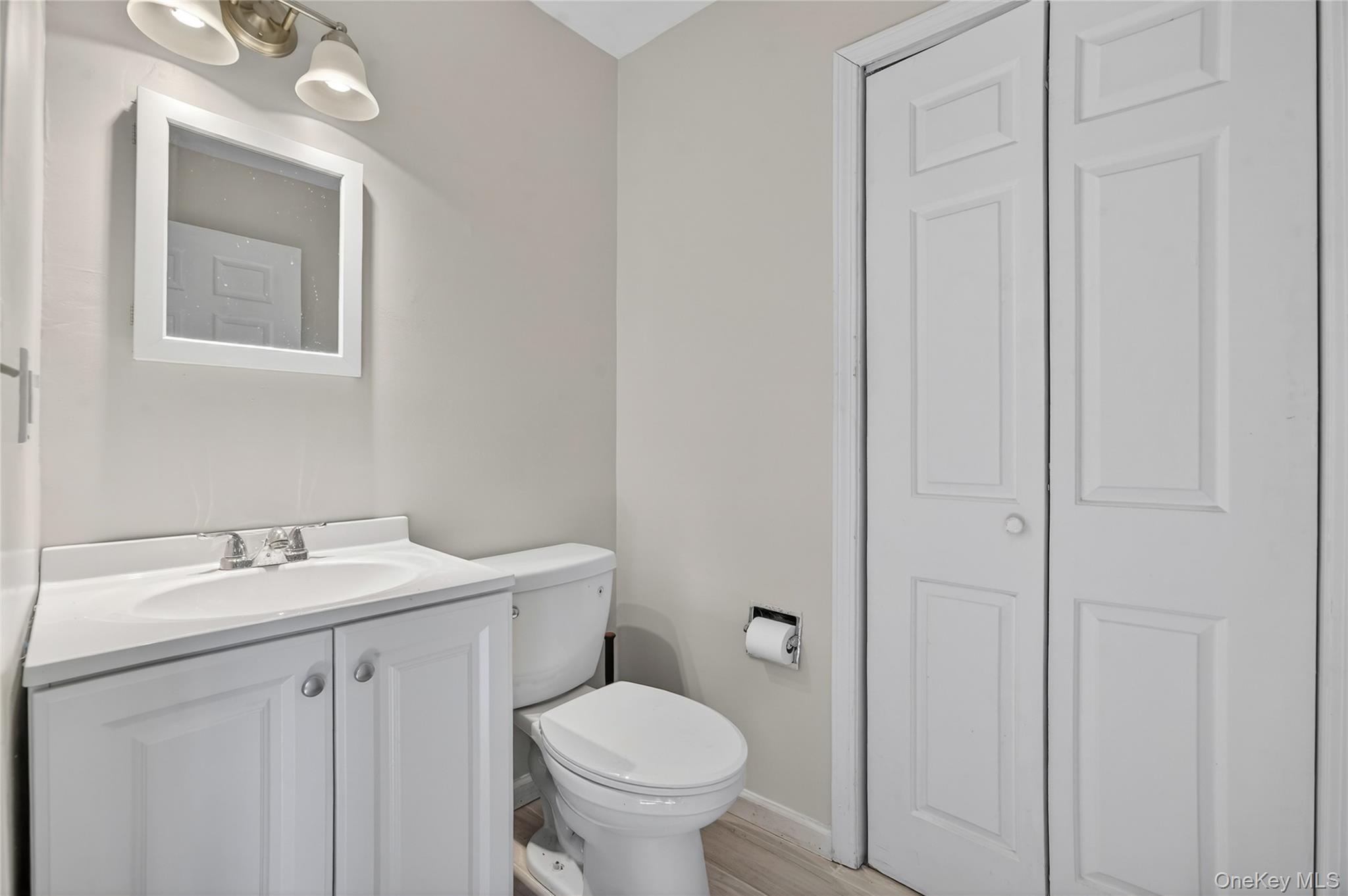 20 Beecher Lane Peekskill, NY 10566 - Photo 17 of 35 a bathroom with a toilet sink vanity and mirror