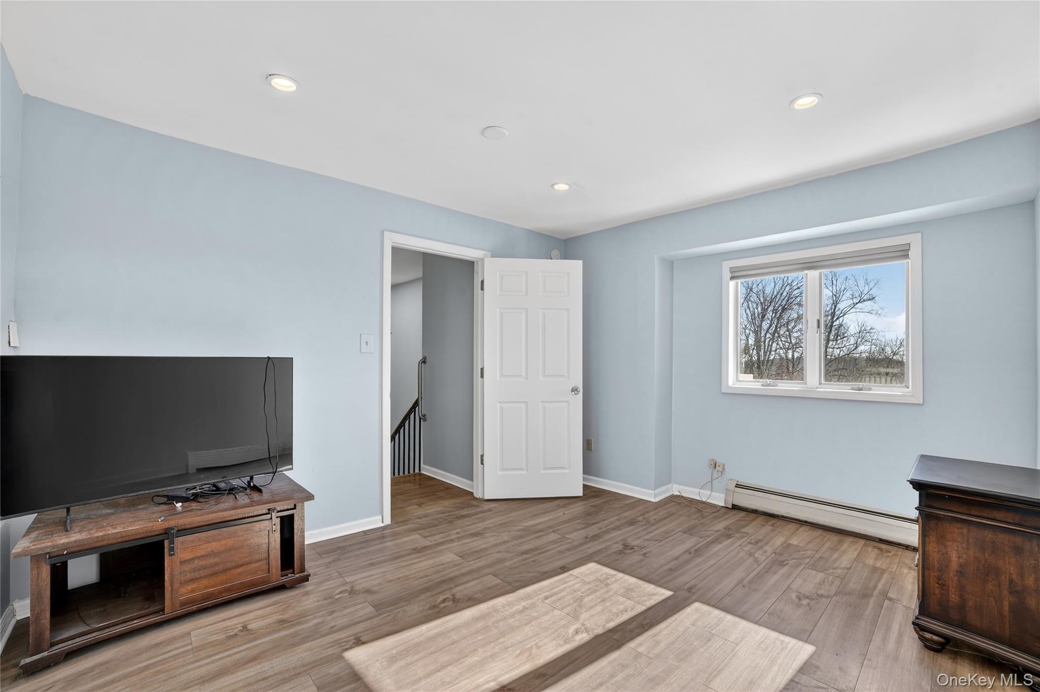 20 Beecher Lane Peekskill, NY 10566 - Photo 24 of 35 a living room with furniture and a flat screen tv