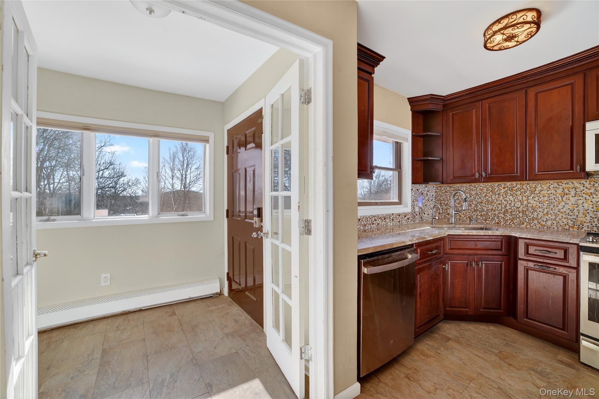 20 Beecher Lane Peekskill, NY 10566 - Photo 6 of 35 a kitchen with stainless steel appliances granite countertop a refrigerator and a sink