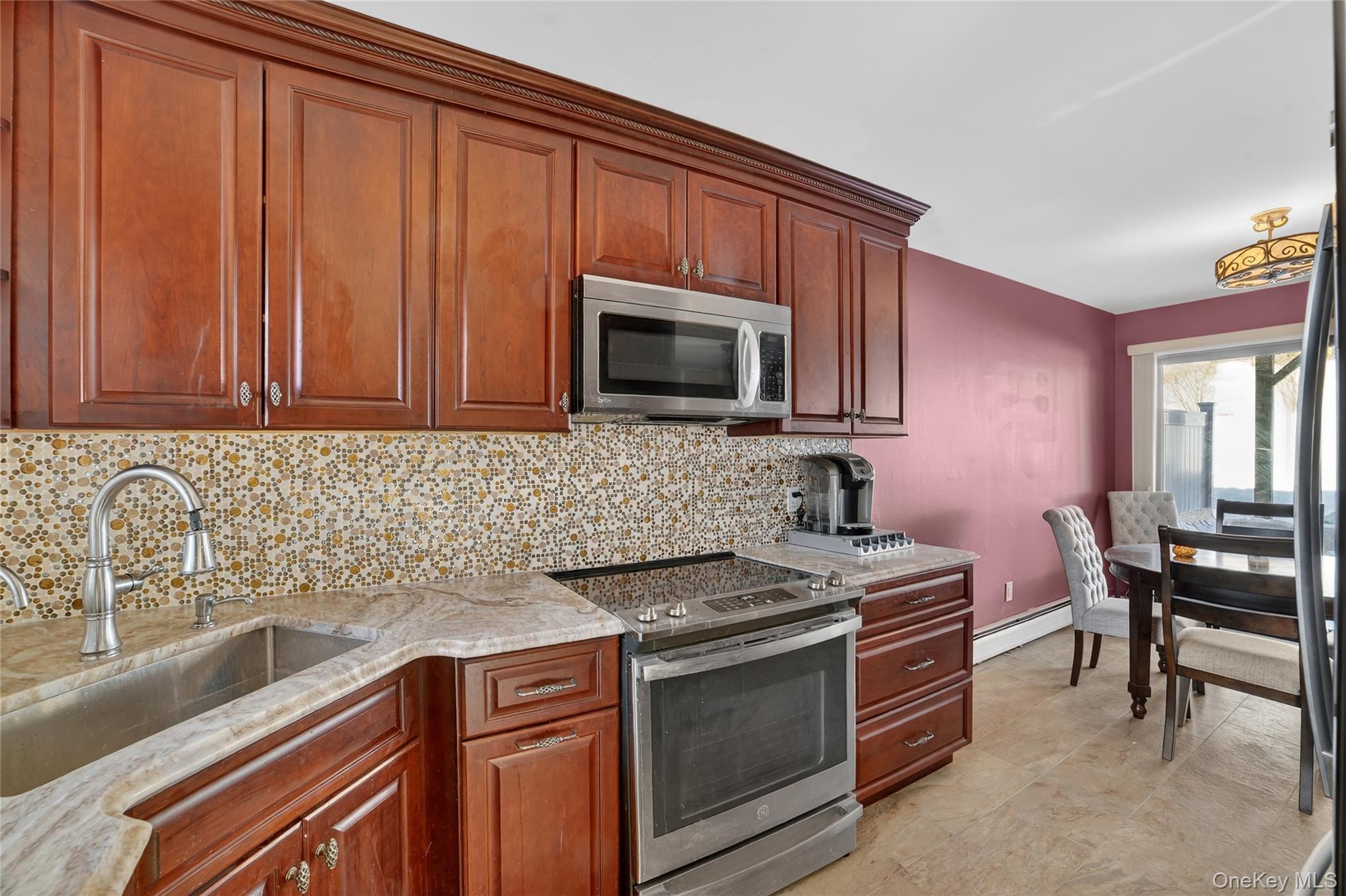 20 Beecher Lane Peekskill, NY 10566 - Photo 9 of 35 a kitchen with granite countertop a sink stove and microwave