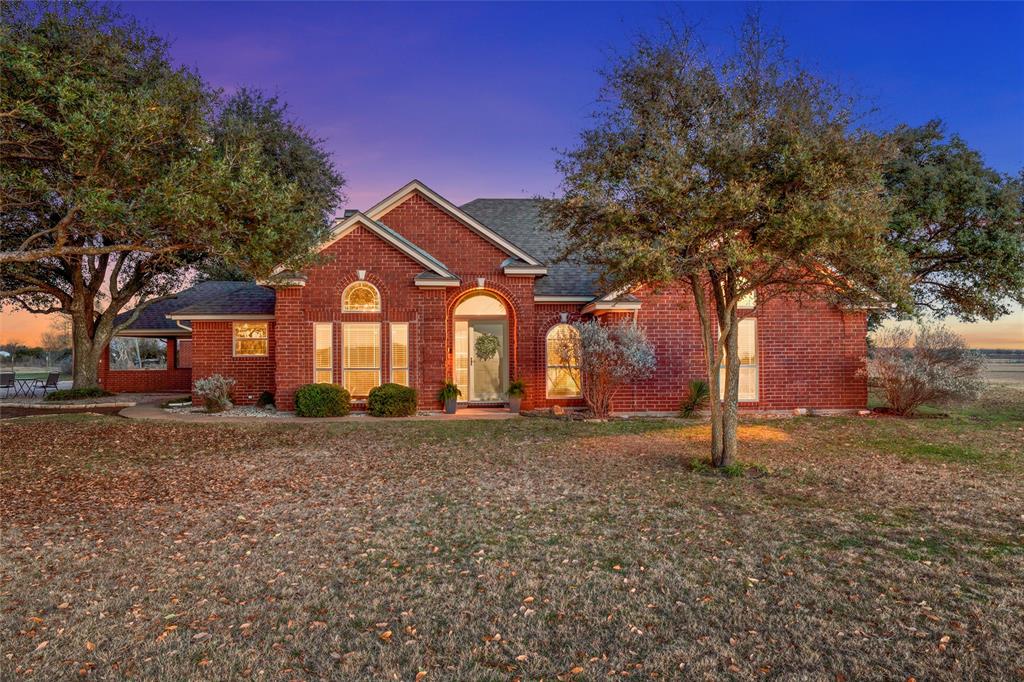 231 Trlica Road West, TX 76691 - Photo 1 of 36 a front view of a house with a yard