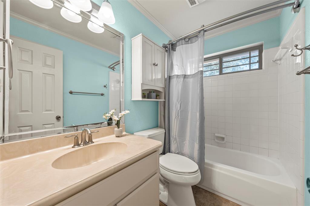 231 Trlica Road West, TX 76691 - Photo 19 of 36 a bathroom with a sink a toilet and shower