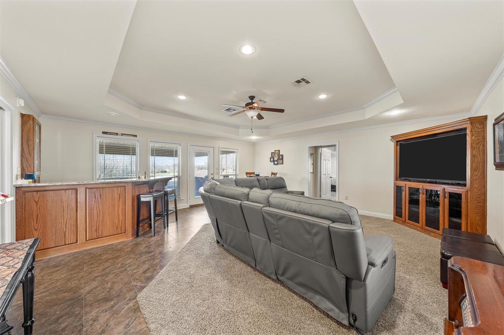 231 Trlica Road West, TX 76691 - Photo 24 of 36 a living room with furniture and a flat screen tv
