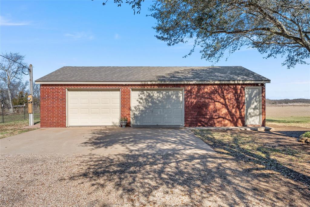 231 Trlica Road West, TX 76691 - Photo 27 of 36 a view of a house with a snow in the yard