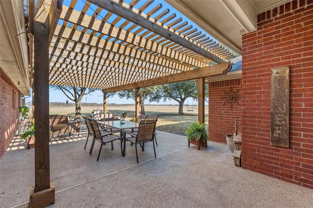 231 Trlica Road West, TX 76691 - Photo 30 of 36 a view of a porch with furniture and a yard