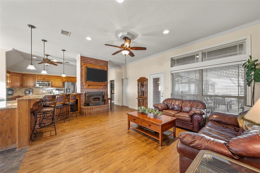 231 Trlica Road West, TX 76691 - Photo 3 of 36 a living room with furniture ceiling fan and a window