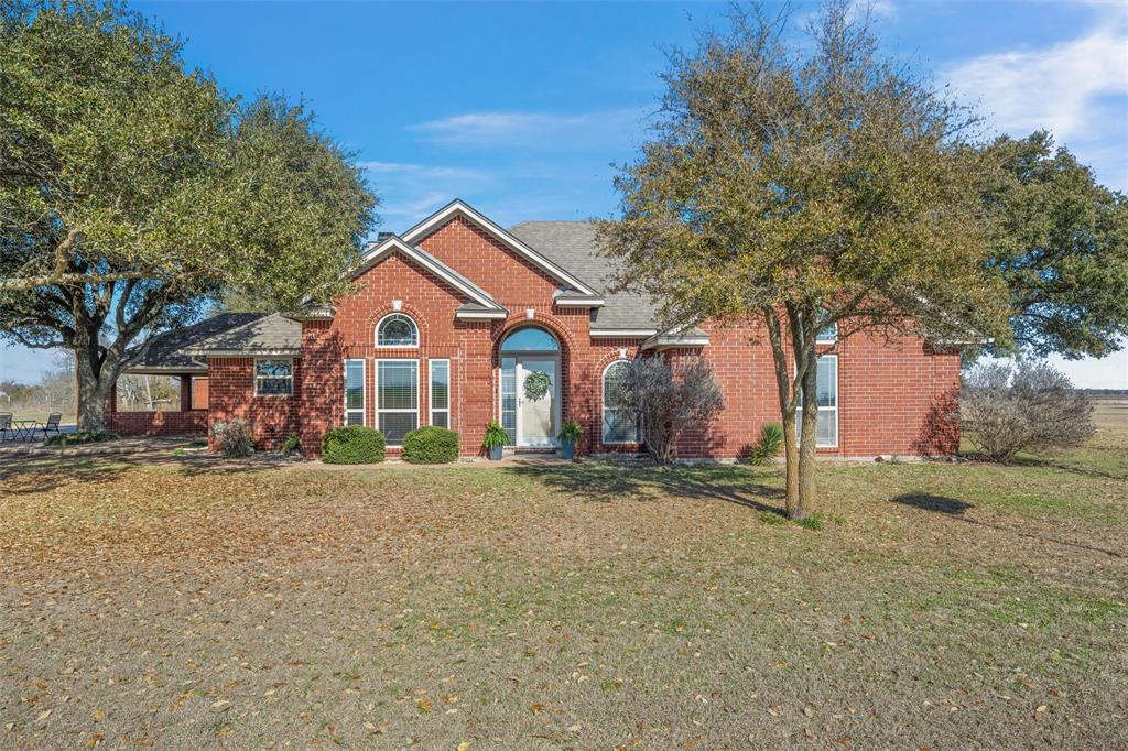 231 Trlica Road West, TX 76691 - Photo 3 of 36 a front view of a house with a yard