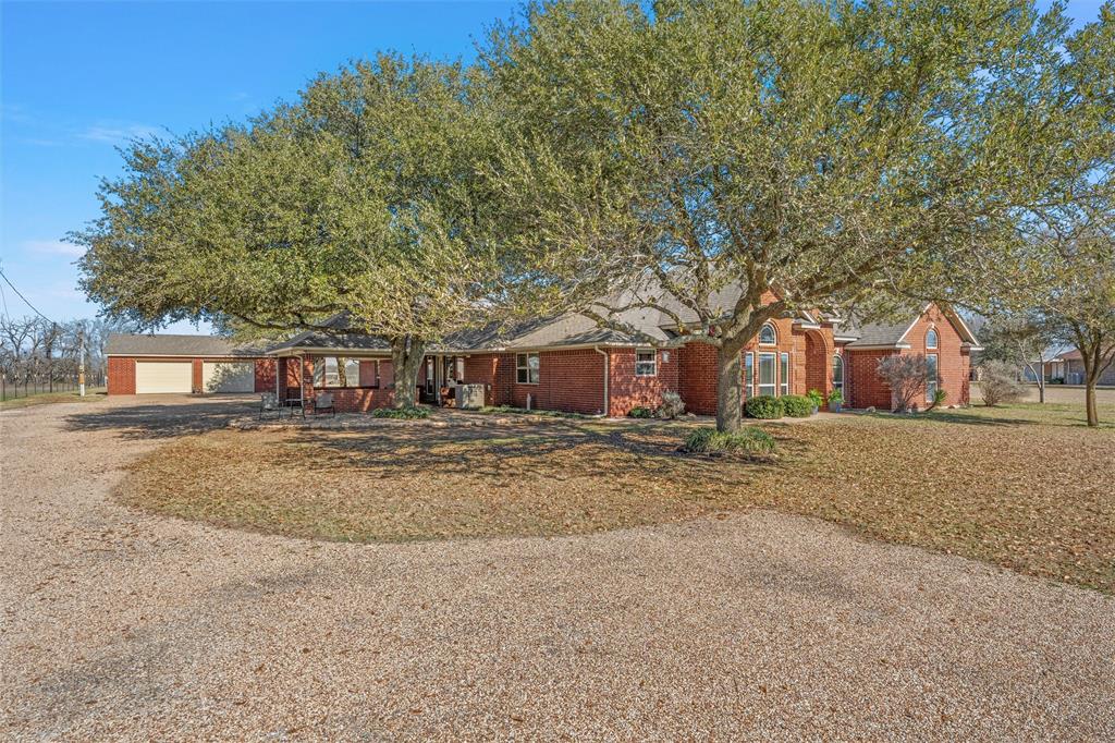 231 Trlica Road West, TX 76691 - Photo 33 of 36 a view of a house with a yard