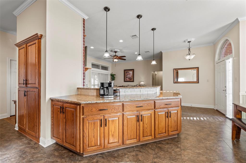 231 Trlica Road West, TX 76691 - Photo 7 of 36 a view of a kitchen with a sink and refrigerator