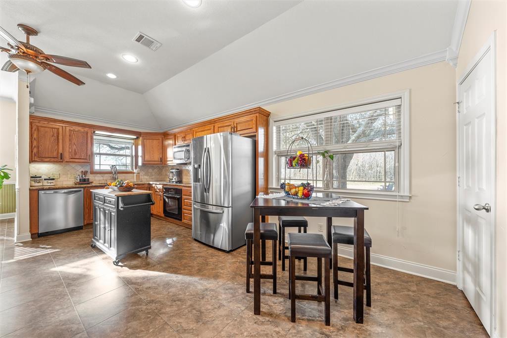 231 Trlica Road West, TX 76691 - Photo 9 of 36 a kitchen with a table and chairs