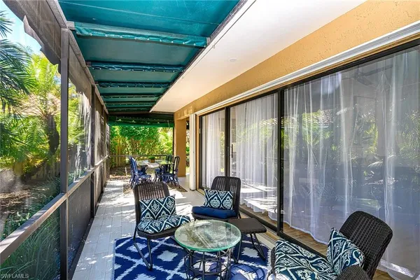 a outdoor dining space with furniture and garden view