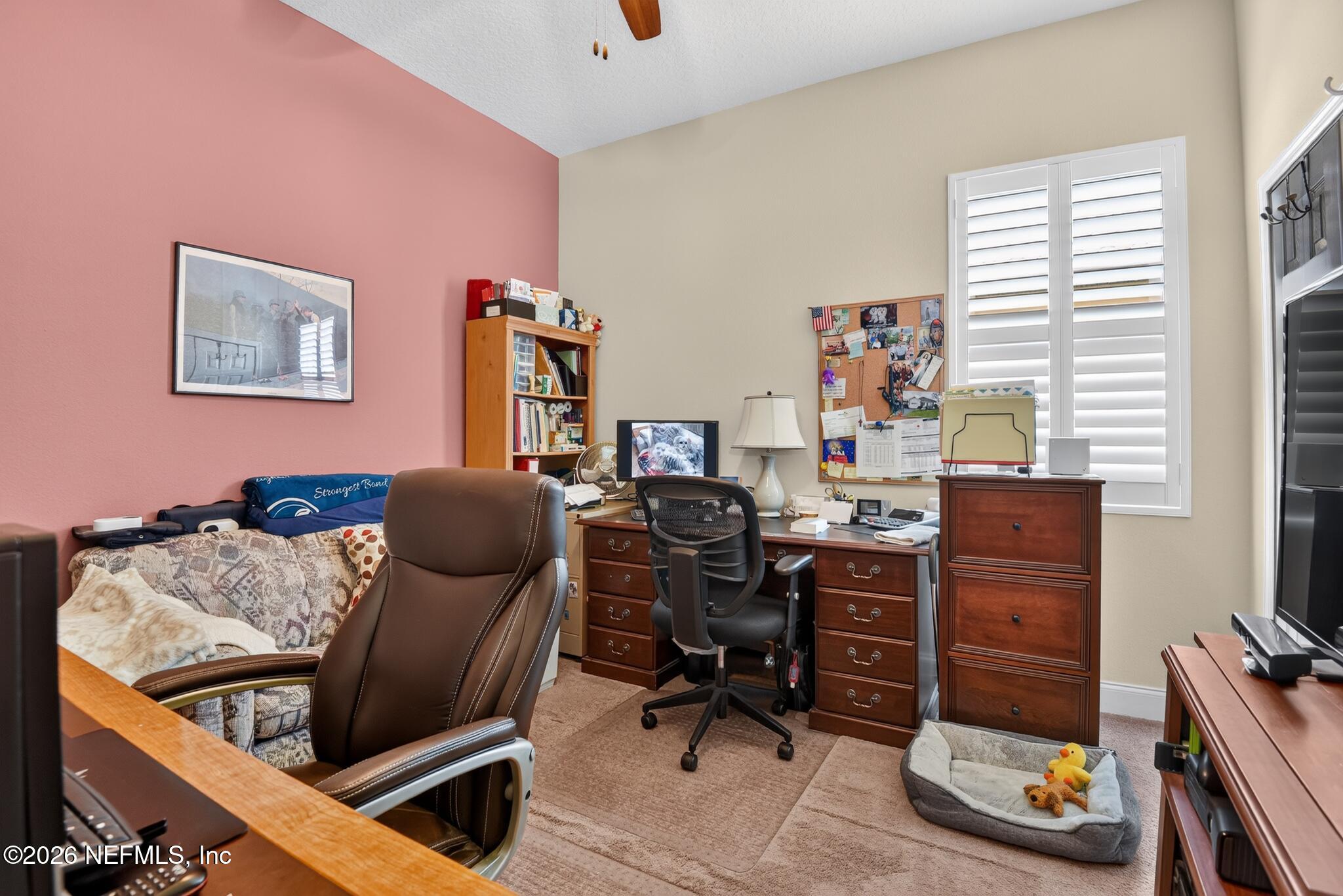 110 Vía Roma Ormond Beach, FL 32174 - Photo 31 of 43 a view of a workspace with furniture and a window