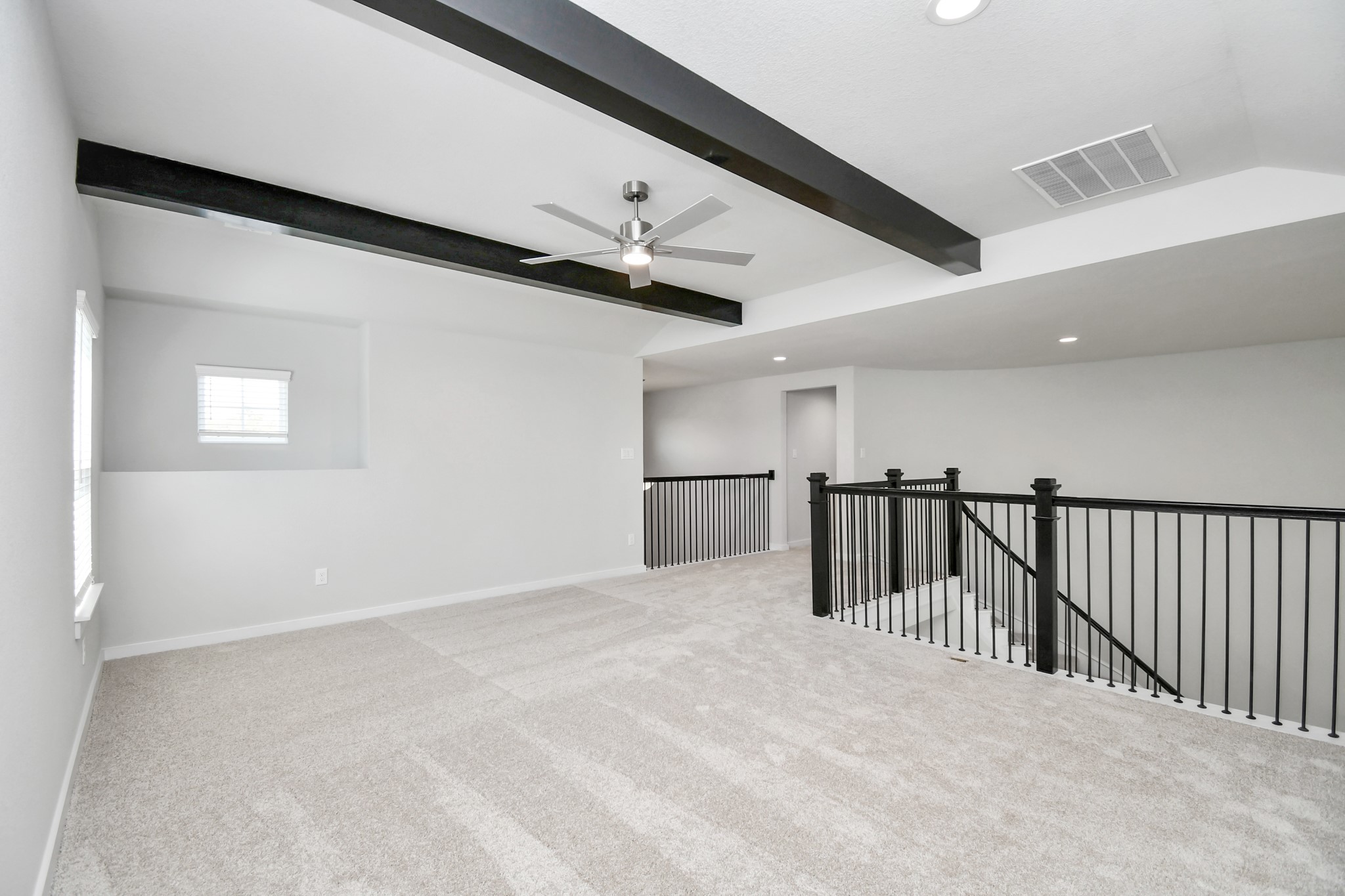 3038 Native Spg Drive Spring, TX 77373 - Photo 27 of 40 Come upstairs and enjoy a day of leisure in this fabulous game room! This is the perfect hangout spot or adult game room! Features plush carpet, high ceilings, custom paint and windows for plenty of natural light. Sample photo of completed home with similar floor plan. Actual colors and selections may vary.