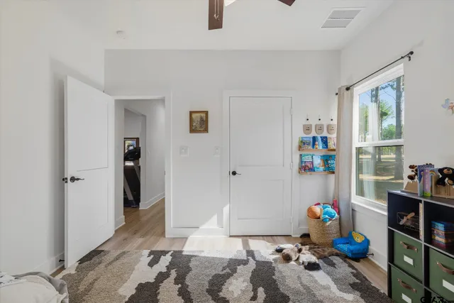 a room with furniture and wooden floor