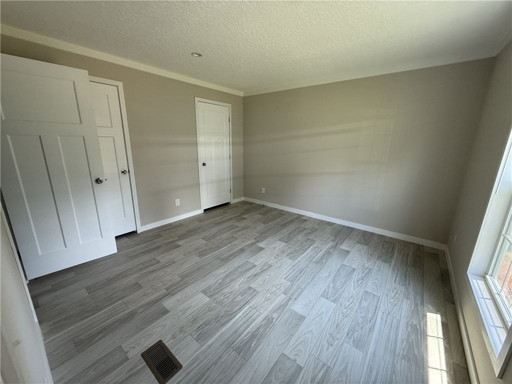 108 Candlestick Lane Seneca, SC 29678 - Photo 3 of 14 Sun-filled room featuring modern flooring and crisp white trim.